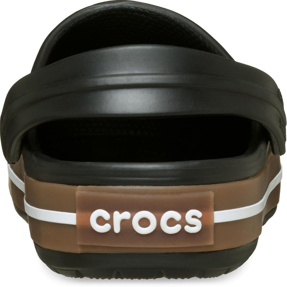 Rear close-up of the black Crocband clog, showing the brown CROCS logo panel set into the gum heel band