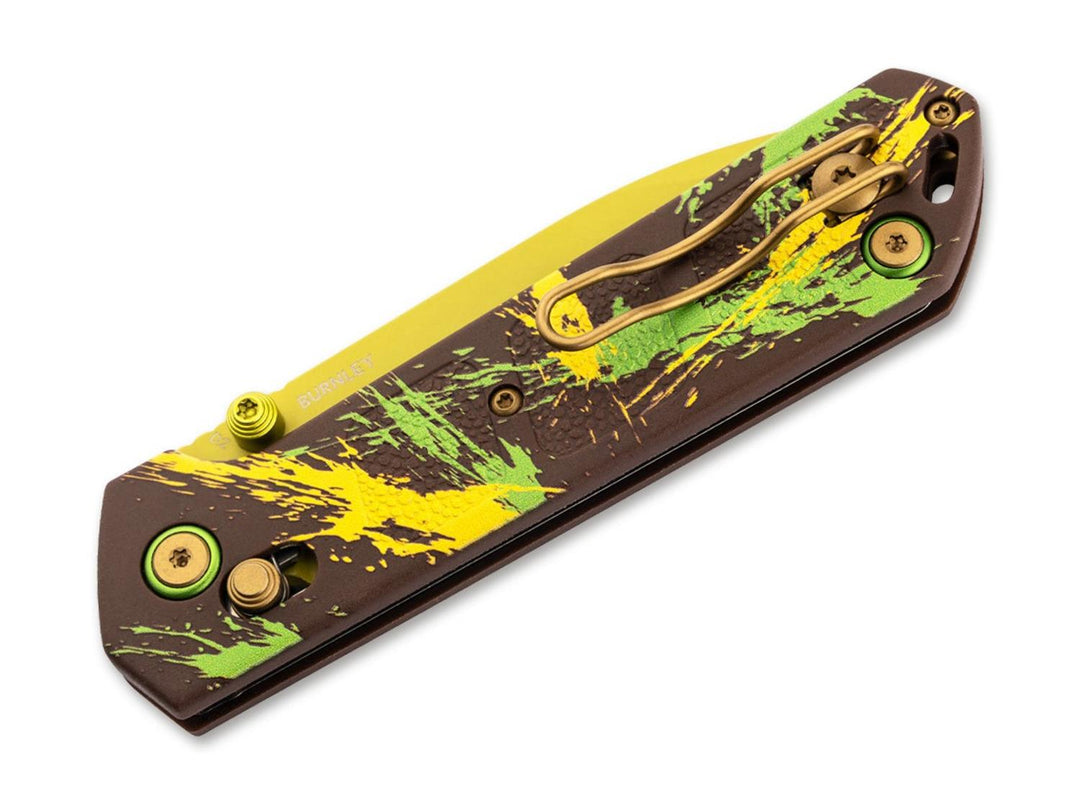 Böker Plus Kihon Dubai Chocolate folding knife closed, brown yellow and green splatter handle with pocket clip, angled view