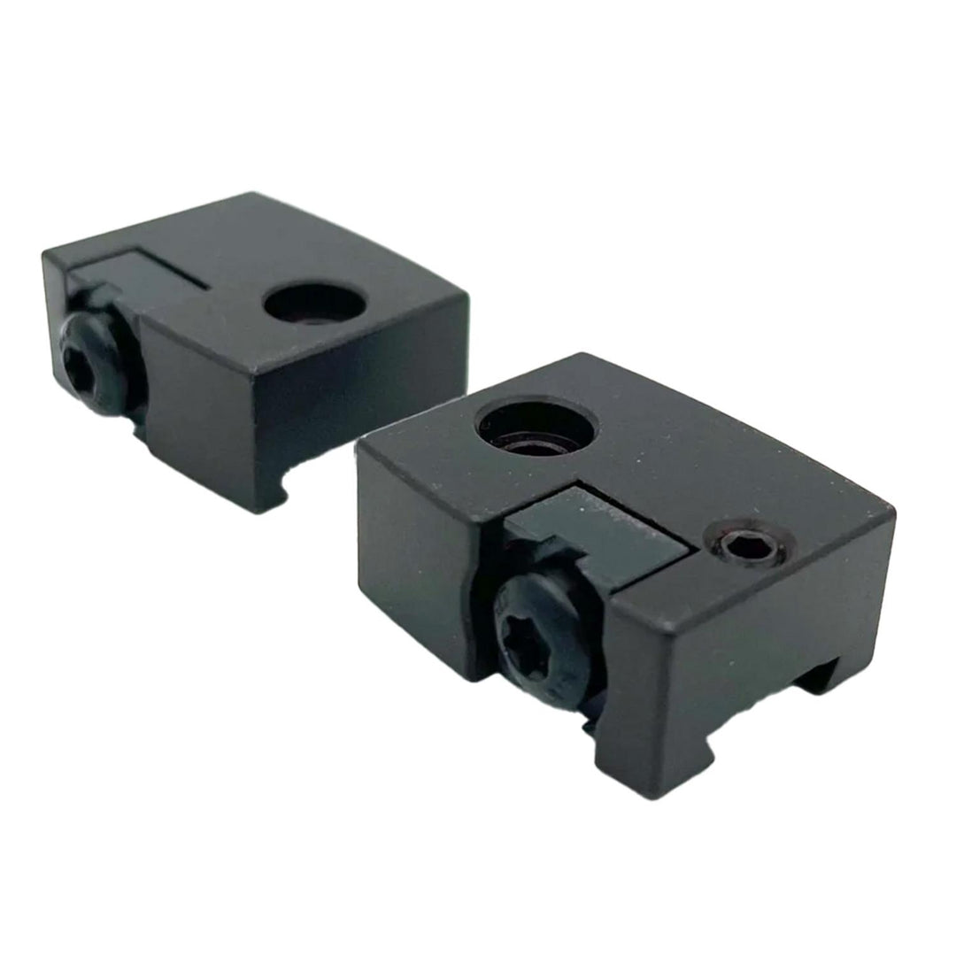 Nieload Sako C8 base mount set, two small black anodised mounting blocks with through-holes and clamp screws, shown side by side at an angle
