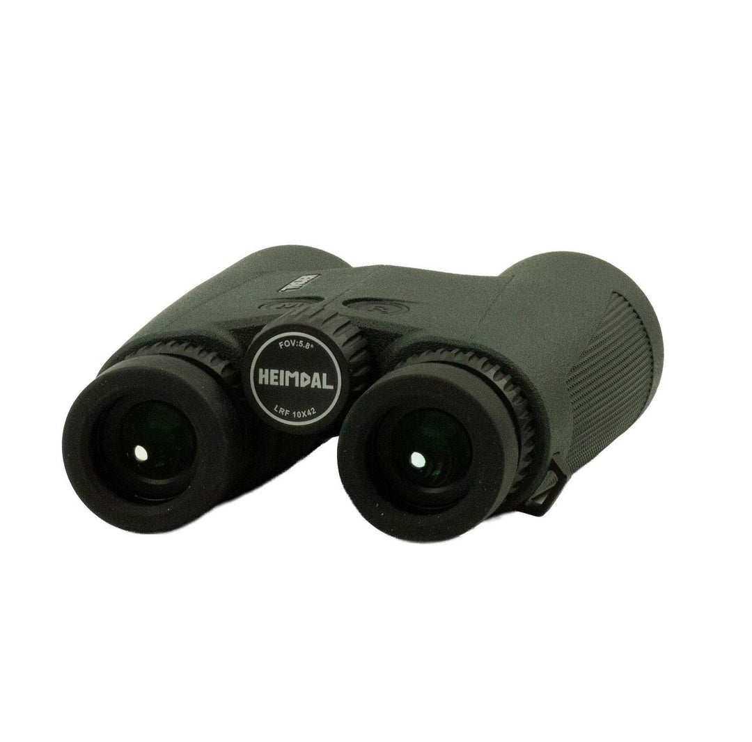 Heimdal binoculars in olive-green rubber armour, viewed from above showing both eyecups, the central focus wheel and the Heimdal name on the bridge