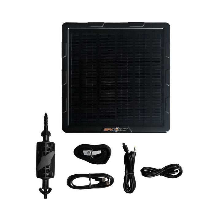 Spypoint SPLB-10 solar panel with its contents laid out: panel, mounting strap, tree screw and two charging cables