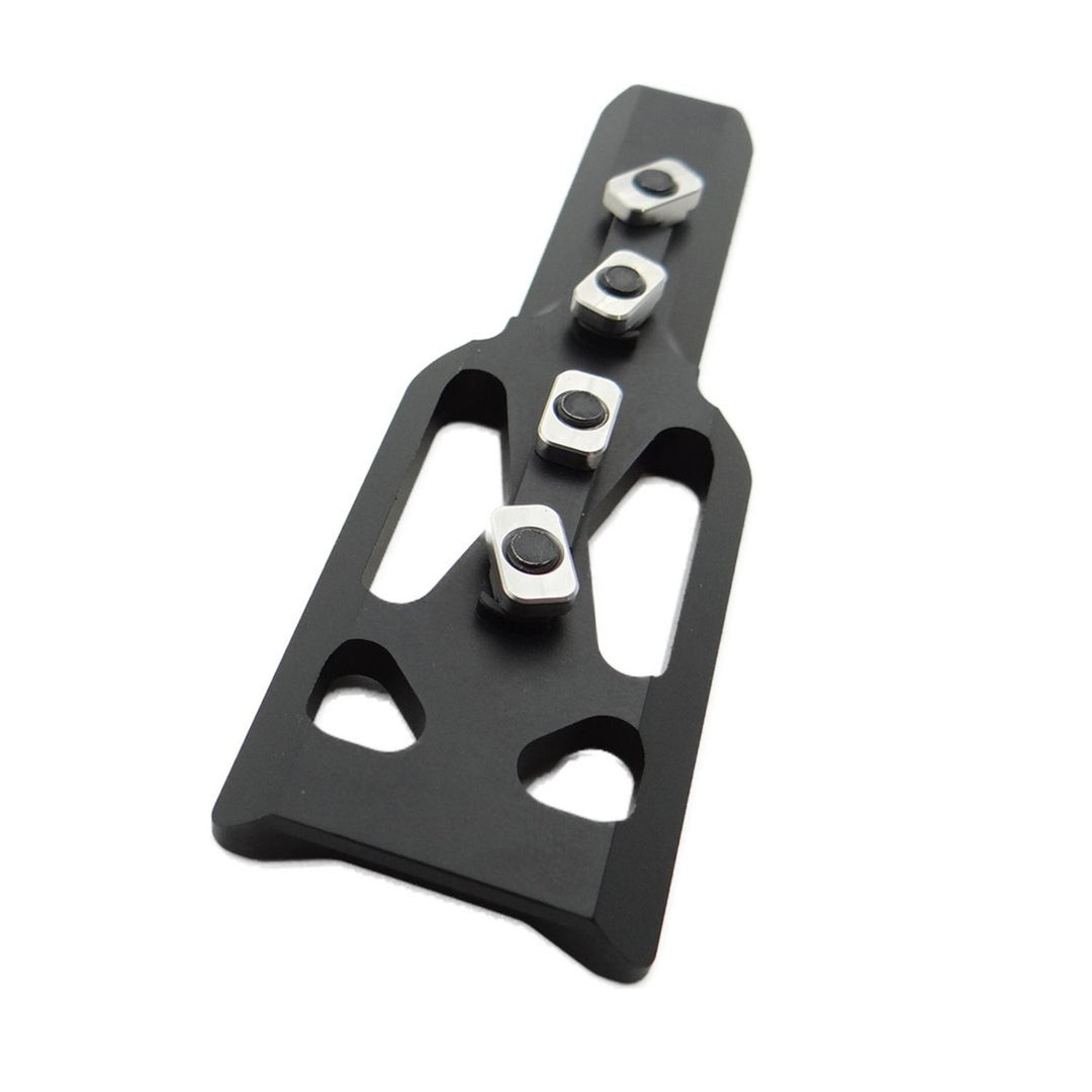 Nieload ARCA/Picatinny M-LOK adaptor viewed from above, showing the lightening cut-outs and four silver M-LOK fixing nuts
