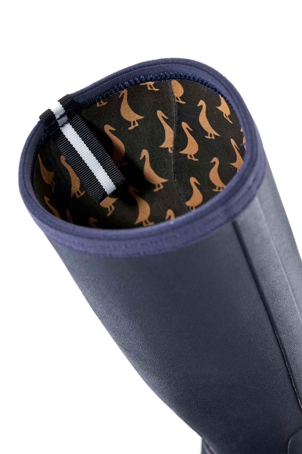 Close-up of the top of a navy Grubs Rainline 2.0 wellington boot showing the duck-print lining and reflective pull strap