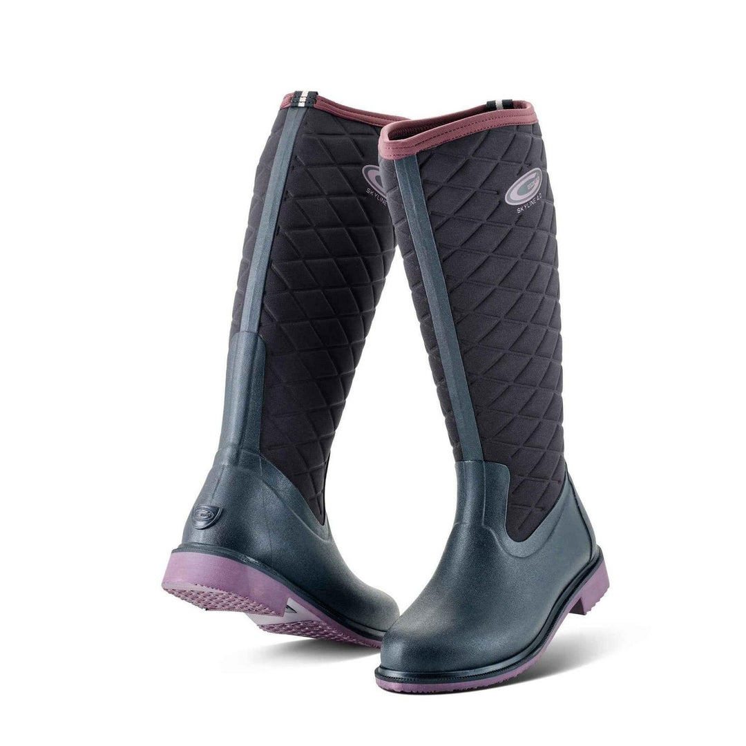 Grubs Skyline 4.0 quilted neoprene ankle boots in black with plum trim and purple sole, tall pair shown from the front three-quarter
