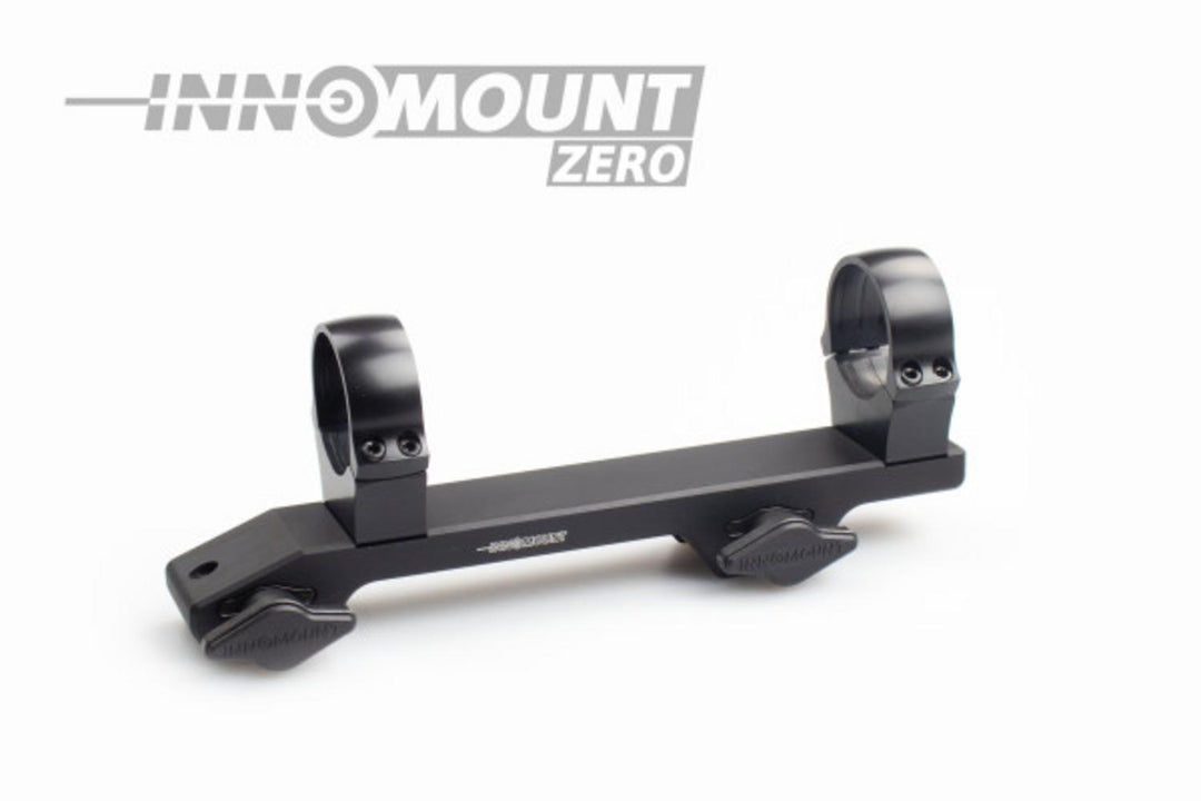 Innomount Zero one-piece scope mount in black anodised aluminium, with two 30mm rings on a long flat base and two quick-release clamping levers for a Weaver or Picatinny rail.