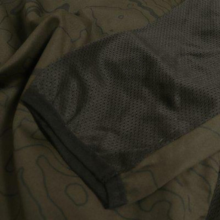 Close-up of the Alpha Antibite sweater sleeve showing the perforated Antibite mesh panel on olive fabric