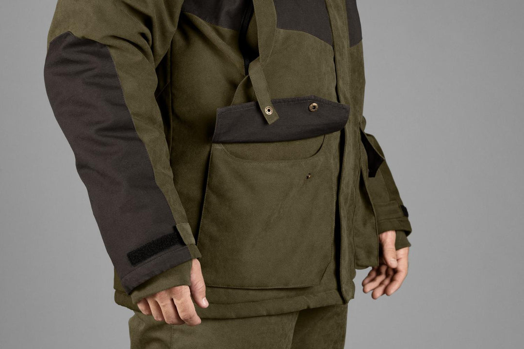 Close-up of the popper-fastened chest pocket flap on the Seeland Taiga jacket, worn