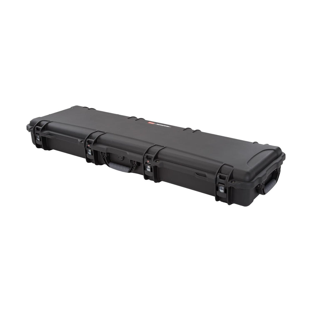 NANUK 995 hard case closed, three-quarter view along its length showing the four PowerClaw latches and end wheels.