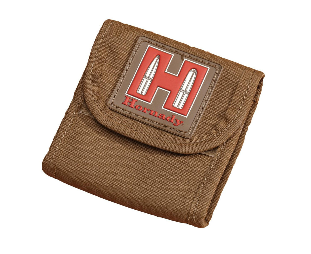 Hornady ammo pouch in tan cordura, front view closed, with the red and white Hornady 'H' cartridge logo badge on the flap.