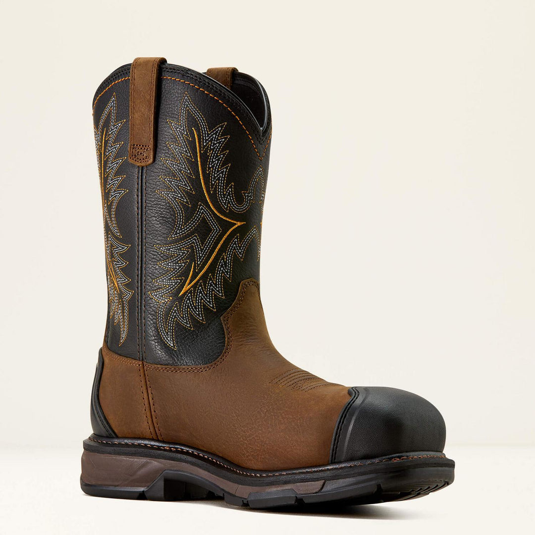 Ariat WorkHog XT brown and black work boot at a three-quarter angle, showing the pull strap, carbon toe cap and heavy outsole