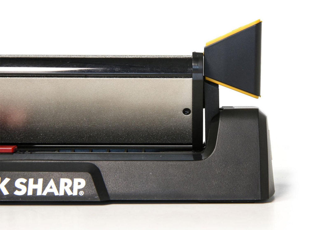Work Sharp Guided Sharpening System base unit with black body and yellow angle guide, partial close-up view