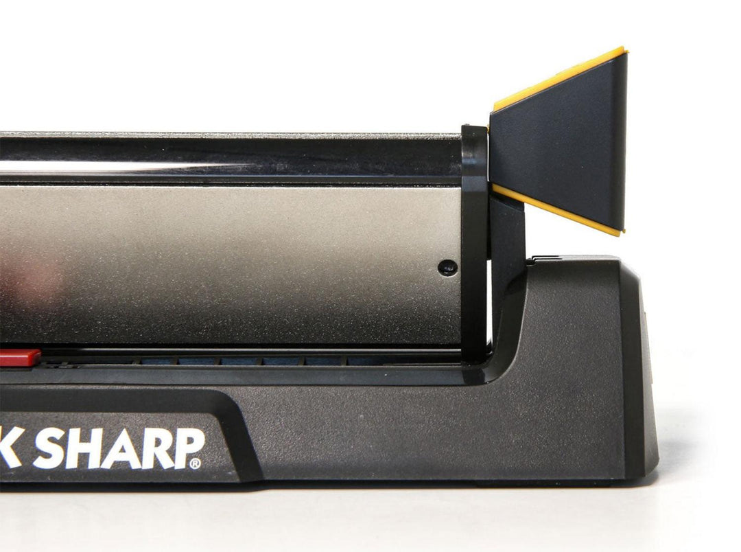 Work Sharp Guided Sharpening System base unit with black body and yellow angle guide, partial close-up view