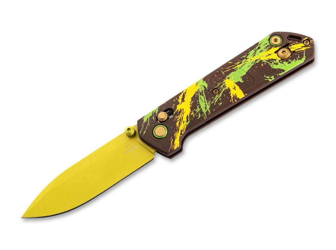 Böker Plus Kihon Dubai Chocolate folding knife with brown handle splattered in yellow and green and a yellow blade, open side view