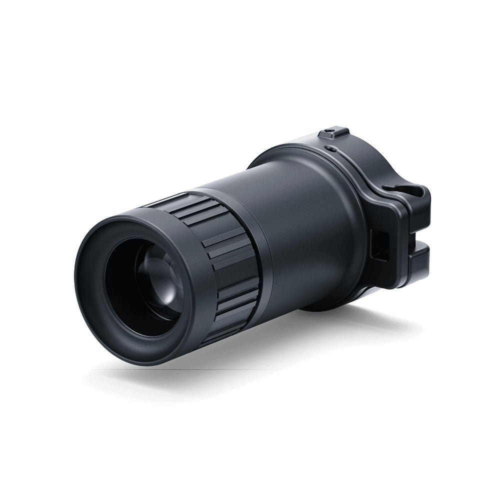 Pulsar 3x20 B monocular viewed front-on into the objective lens, with the quick-release mounting bracket visible at the rear