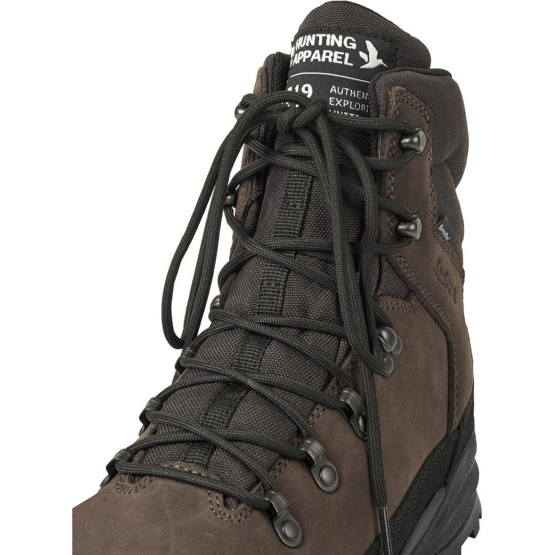 Close-up of the front lacing hooks and brand tag on the Seeland Enduro Explore Mid boot