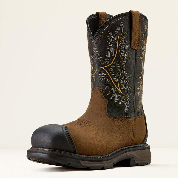 Ariat WorkHog XT boot with brown vamp and black embroidered shaft, three-quarter front view showing the black rubber carbon-toe cap