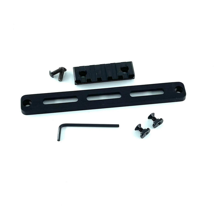 Nieload MDT Oryx M-LOK Picatinny rail kit shown at a slight angle: black slotted rail, Picatinny insert, hex key and two mounting nuts