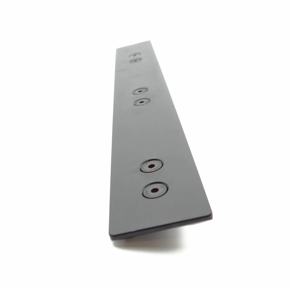 Nieload ARCA forend rail shown at a steep angle from the underside, black bar with countersunk mounting holes
