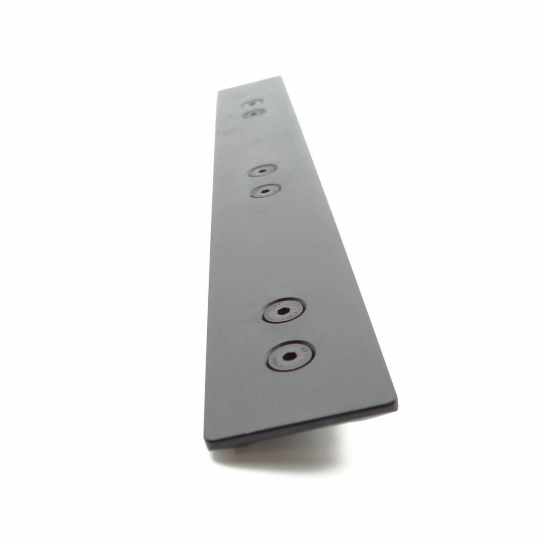 Nieload ARCA forend rail shown at a steep angle from the underside, black bar with countersunk mounting holes