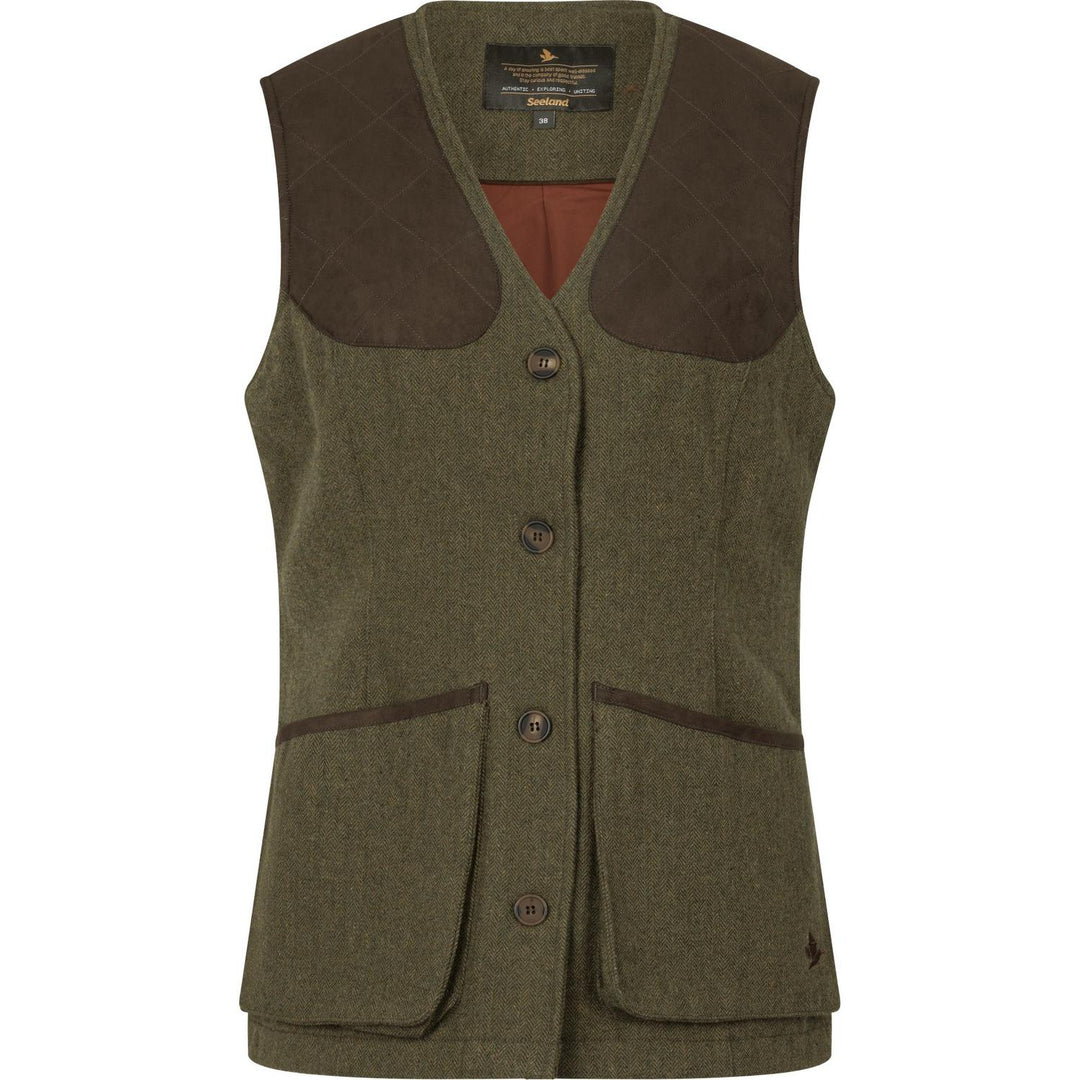 Seeland Hillside Harriet ladies waistcoat in olive herringbone tweed, front-on and shaped to the waist, with brown suede shoulder patches and rust-orange lining at the neck.