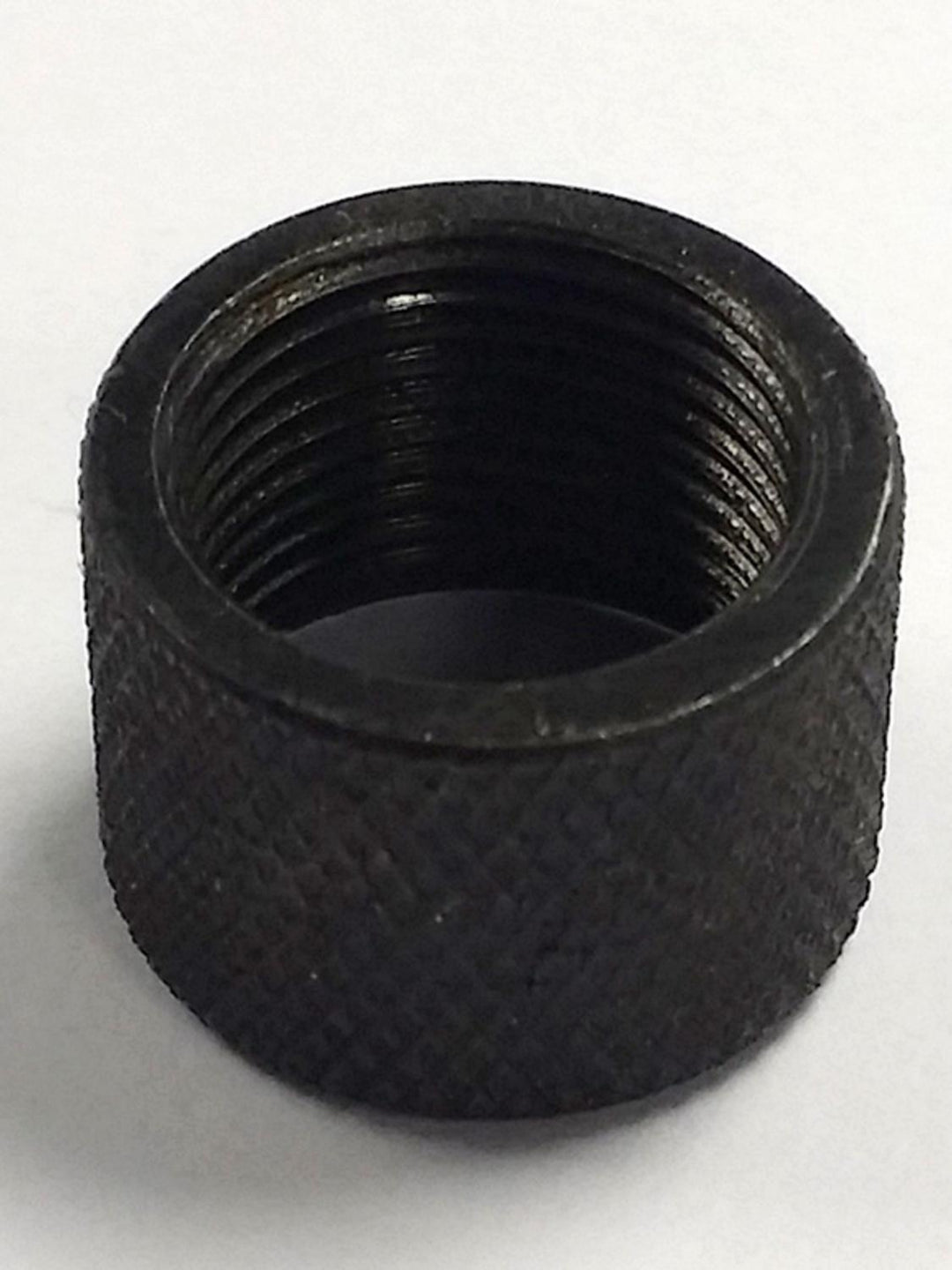 Blued steel rifle thread protector cap with a knurled outer surface, viewed from the open end to show the internal threads.