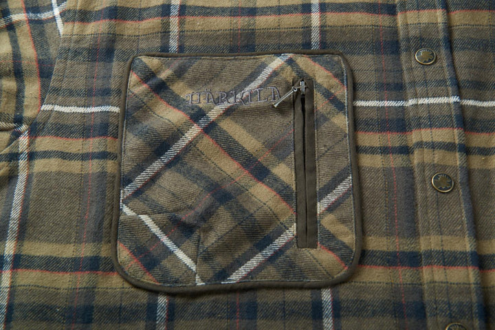 Close-up of the second Harkila Pajala chest pocket, with a vertical zip and the embossed Harkila name across the flap.