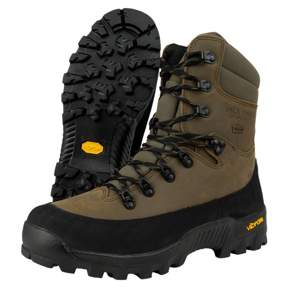 Jack Pyke Hunters boots, one boot tipped back to show the black Vibram lugged sole from below beside an upright boot.