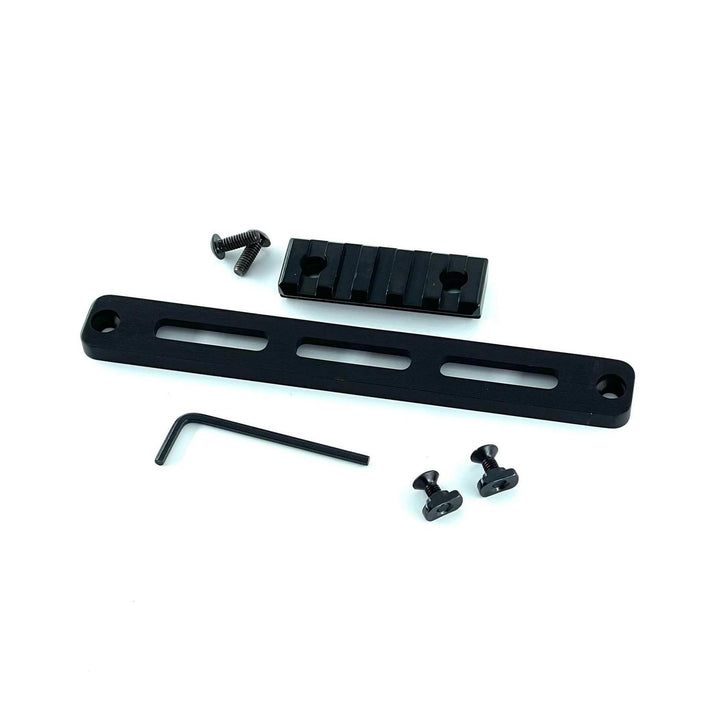 Nieload MDT Oryx M-LOK Picatinny rail kit, flat-lay with the slotted rail bar horizontal, the Picatinny section above it and the hex key and fixings alongside