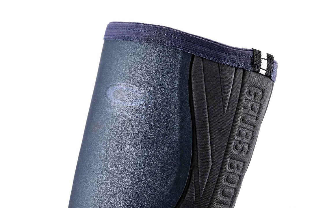 Side view of the upper shaft of a navy Grubs Rainline 2.0 wellington boot with Grubs logo and reflective strap