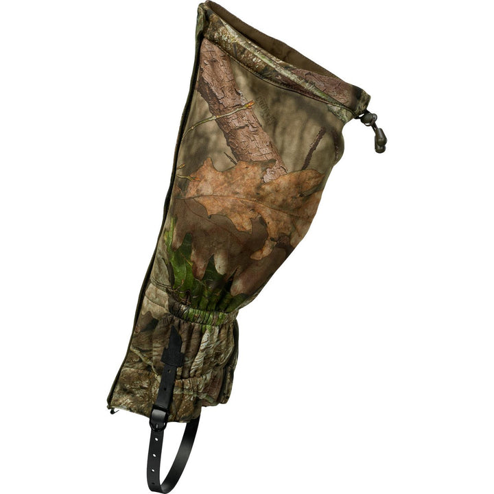 The same gaiter from the inner side, top drawcord toggle cinched and the black buckled under-boot strap hanging free.