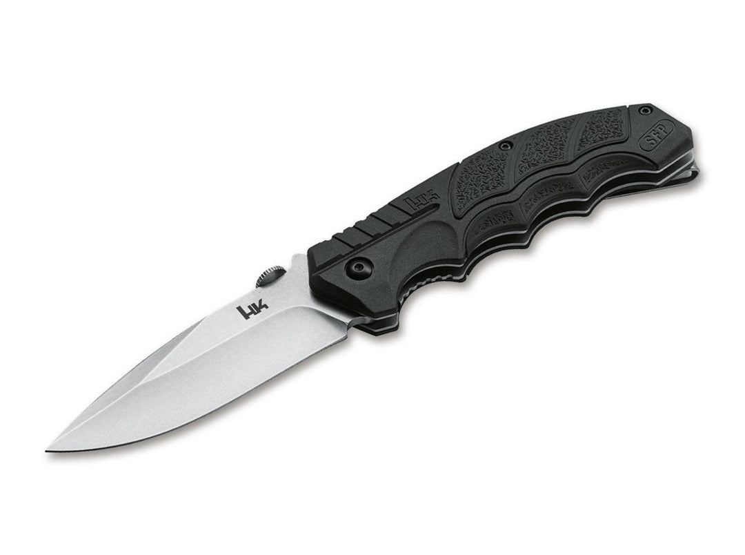 Böker SFP Tactical folding knife with black textured handle and satin drop-point blade marked H&K, open side view