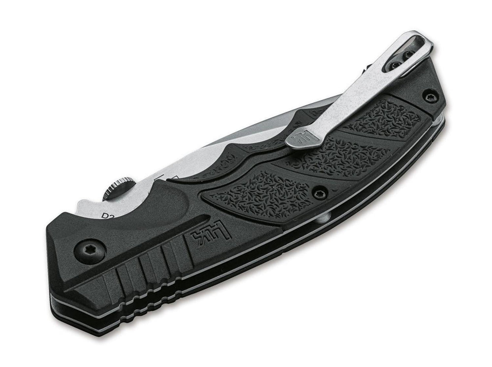 Böker SFP Tactical folding knife closed, black textured handle with pocket clip and H&K logo, angled view