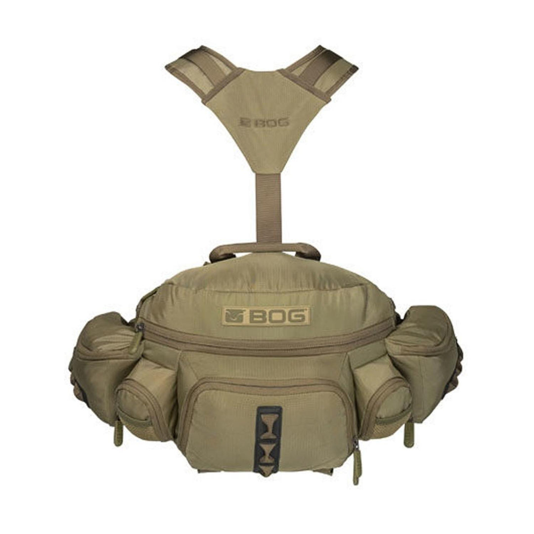 Bog Ultimatum hunting pack in tan and olive, front view of the hip pack with side pockets and the Y-shaped shoulder harness above