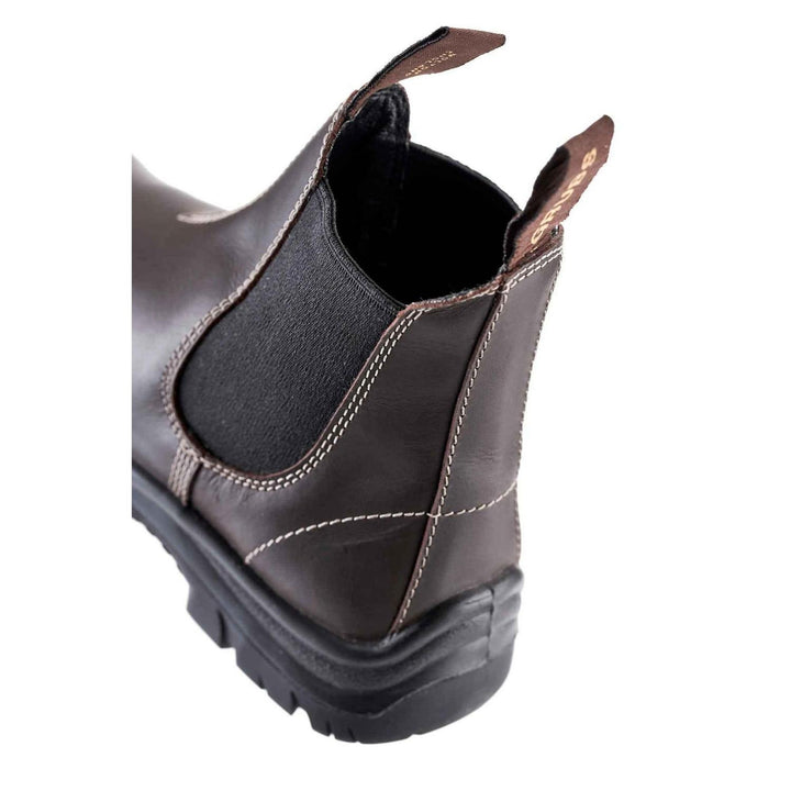 Close-up of the heel, elastic gusset and pull tabs on a brown Grubs Tempest leather dealer boot