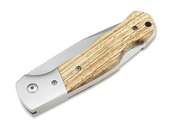 Böker Magnum Rustic folding knife closed, light wood handle with steel bolster, angled view