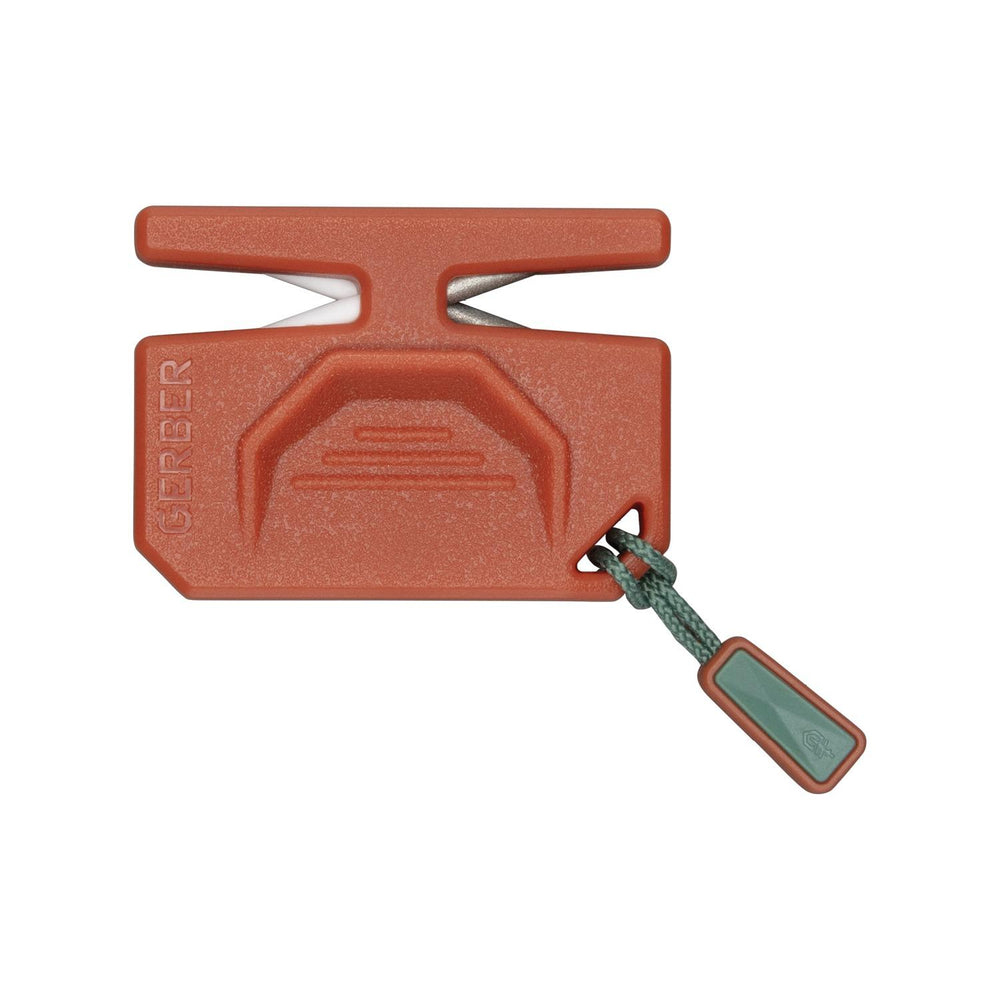 Reverse of the Gerber ComplEAT camp sharpener, plain orange body with the Gerber logo and the green fabric lanyard pull